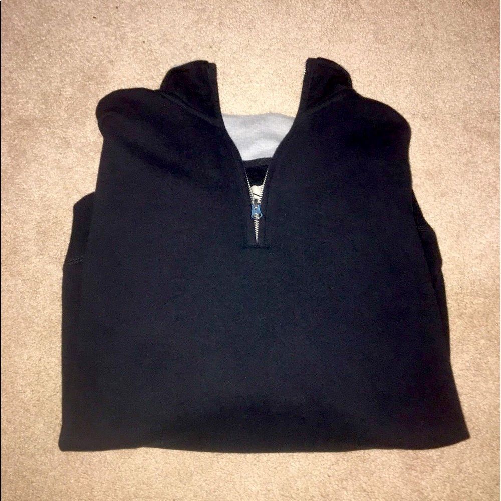 Men's navy pullover with gray neck lining